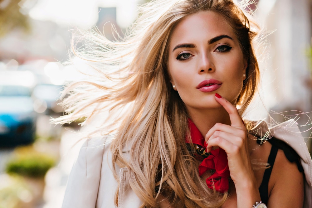 blonde woman with beautiful makeup looking at camera