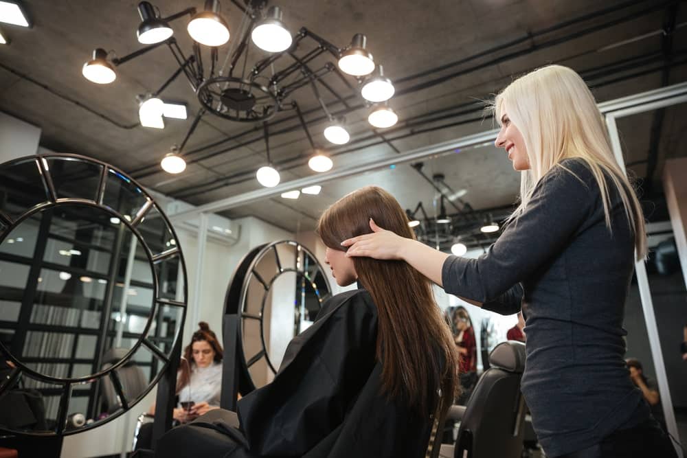 hairstylist working on client's hair