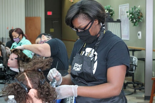 Student practcing on a mannequin