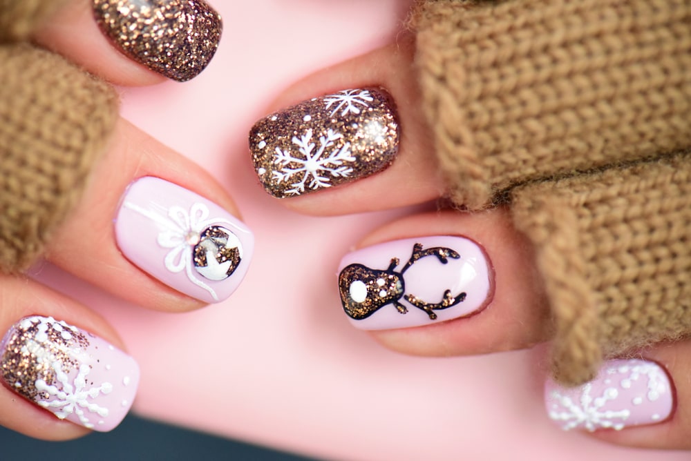 cute nails with reindeer and snowflakes
